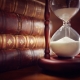 hourglass and old books
